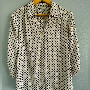 Beautiful blouse by Dressbarn with colorful print in brown blue and red design.